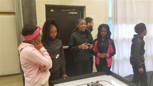 students playing with robots 